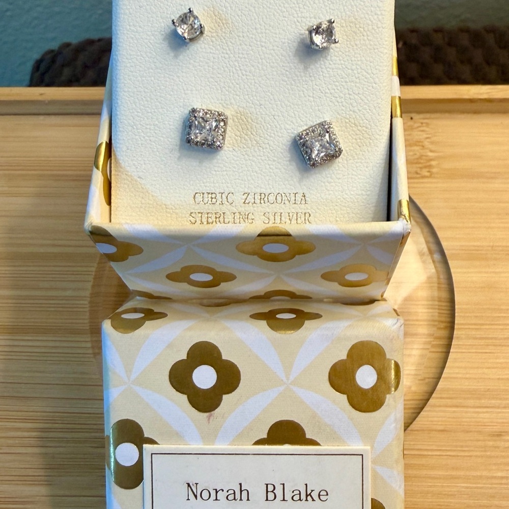 2 sets of cubic zirconia stud earrings in sterling silver branded by Norah Blake
